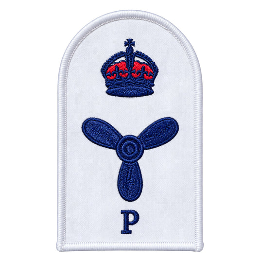 White embroidered naval rank insignia patch featuring a blue crown with red detailing above a blue propeller, and the letter ’p’ below