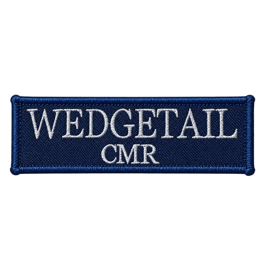 Navy blue embroidered patch with white thread lettering reading ’wedgetail cmr’