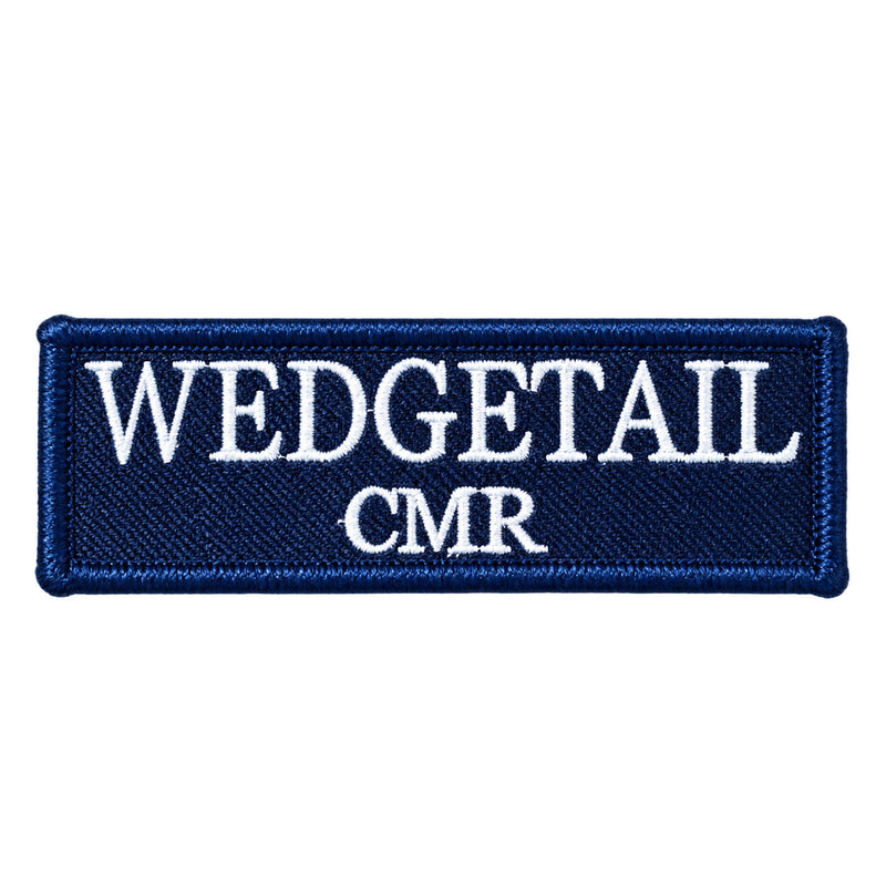 Load image into Gallery viewer, Navy blue embroidered patch with white stitched lettering reading ’wedgetail cmr’
