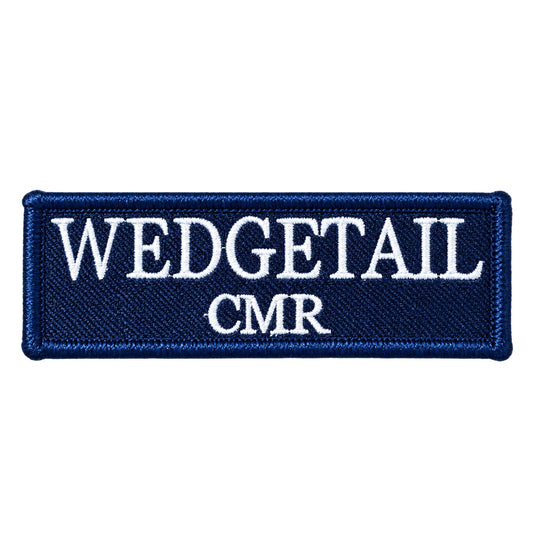 Navy blue embroidered patch with white stitched lettering reading ’wedgetail cmr’